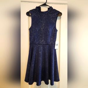 Special occasion dress. New w/tag. Navy with beautiful sparkling silver threads.